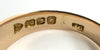Close-up of J.G maker’s mark and 12ct stamps inside antique rose gold ring, Chester 1913