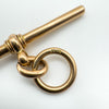 Detailed view of hallmarked jump ring on antique 9ct gold T-bar pendant