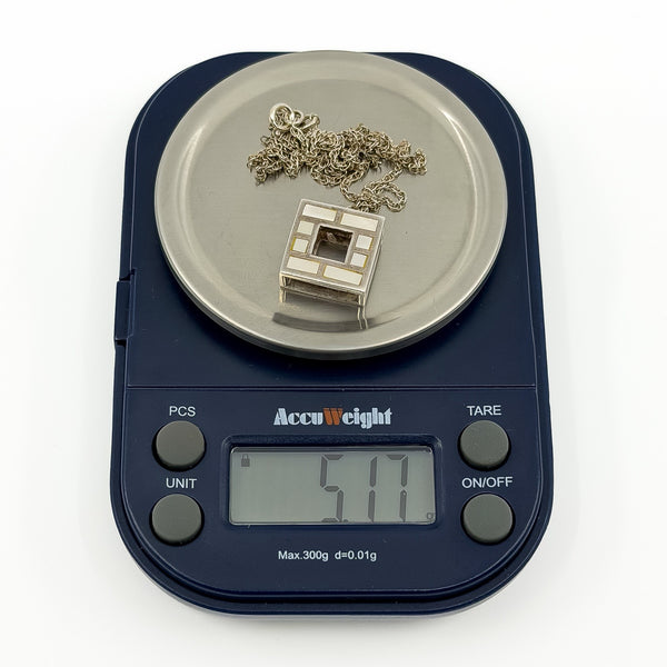 Vintage Kit Heath sterling silver mother of pearl necklace shown on digital scales