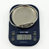 Kit Heath sterling silver mother of pearl bangle shown on scales weighing approx. 14.3g