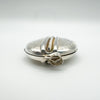 Close-up of silver locket’s large bail and twisted rope running down the middle