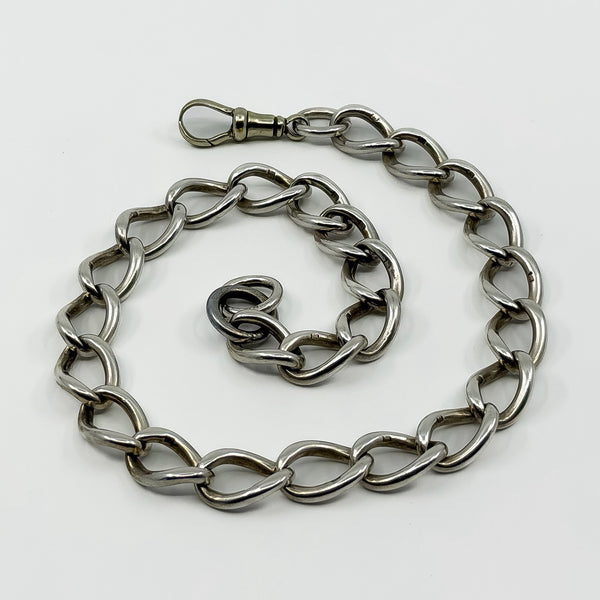 Chunky oval link Albert chain with large dog clip and sterling silver link stamps visible