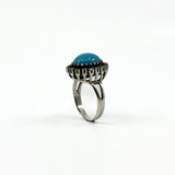 Large sterling silver ring with turquoise centre and natural diamond halo detail