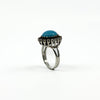 Large sterling silver ring with turquoise centre and natural diamond halo detail