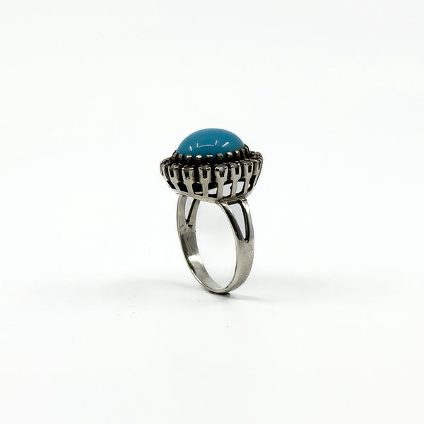 Large sterling silver ring with turquoise centre and natural diamond halo detail