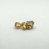 Blue topaz angel pendant viewed from left side showing gold tone finish