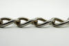 Close up of lion passant stamps on oval links of antique sterling silver Albert chain