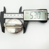 Digital caliper showing height of vintage silver locket as 53mm