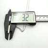 Measuring the depth of sterling silver locket at 3.2mm with digital calipers