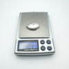 Oval sterling silver locket weighing 10.9g on digital scale