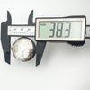 Sterling silver round locket shown in callipers measuring 38.3mm across