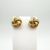 Pair of vintage 9ct rose gold lovers knot earrings shown on display stand