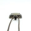 Close-up of the marcasite-set bail on the sterling silver pendant, showing the textured detailing.