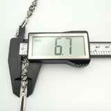 Fleur De Lys link width of 6.7mm shown with calipers