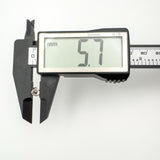 Digital caliper showing horseshoe earring height at 5.7mm