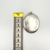 Height of chunky sterling silver locket shown against ruler, approx. 51mm