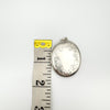 Oval sterling silver locket measured at approx. 51mm in height with tape measure