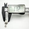 Digital caliper showing notebook pendant width at 11.2mm