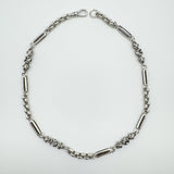 Vintage sterling silver 16 inch chain with Fleur De Lys pattern laid flat
