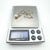 Vintage pearl drop necklace on digital scale weighing approximately 3.3g