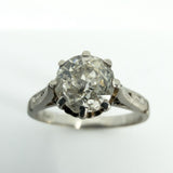 Detailed view of old-cut diamond in antique platinum eight-claw solitaire ring setting