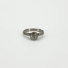 Straight-on view of antique platinum solitaire ring with old-cut diamond in eight-claw setting