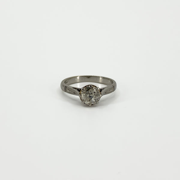 Straight-on view of antique platinum solitaire ring with old-cut diamond in eight-claw setting
