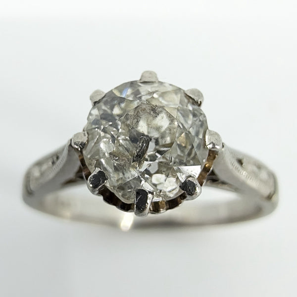 Close up of antique old-cut diamond in eight-claw platinum solitaire ring setting