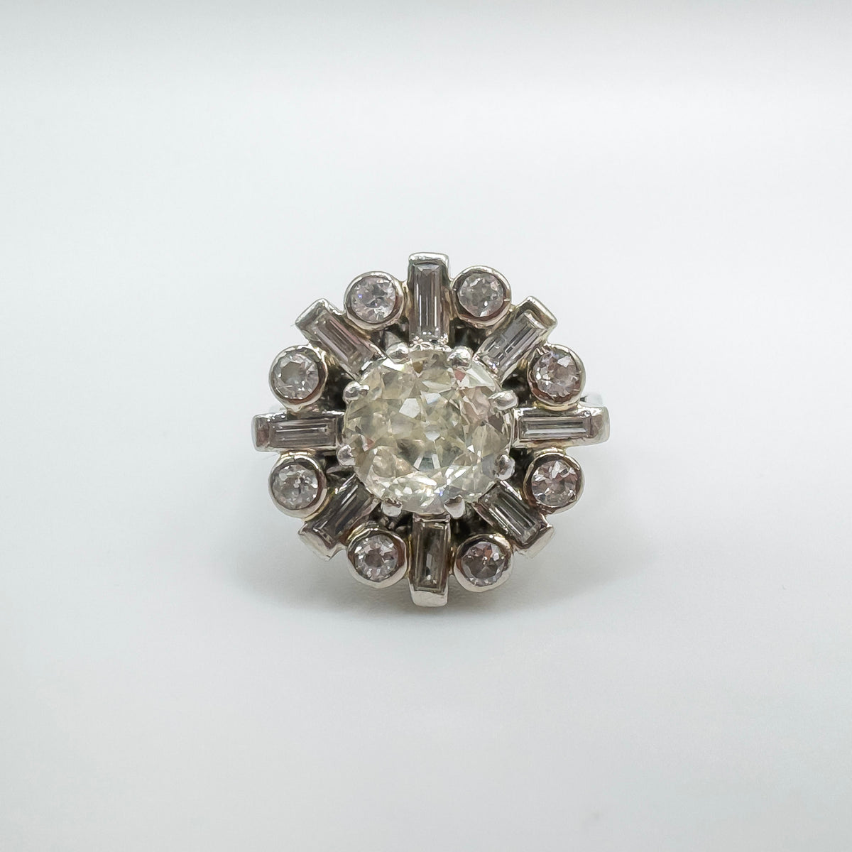 Old cut diamond cluster ring in a raised setting