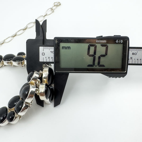 Black onyx necklace side setting measured at approximately 9.2mm deep with digital callipers