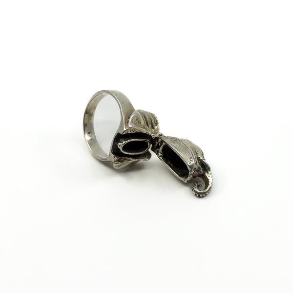 Open sterling silver elephant locket ring showing the small hidden compartment inside