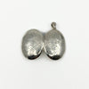 Open oval sterling silver photo locket showing matching engraved outer covers