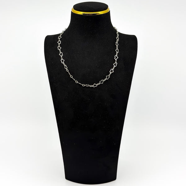 Vintage sterling silver open heart necklace displayed on a black bust to show the 17 inch length