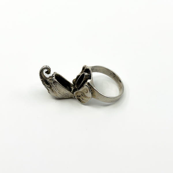 Open vintage sterling silver elephant ring showing the hinged locket compartment and 925 stamp inside band