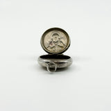 Open sterling silver Virgin Mary photo locket pendant showing the interior and jump ring.