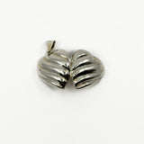 Open vintage sterling silver puffy heart photo locket showing both rounded halves.