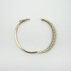 Vintage oval bangle open showing push clasp and scroll pattern