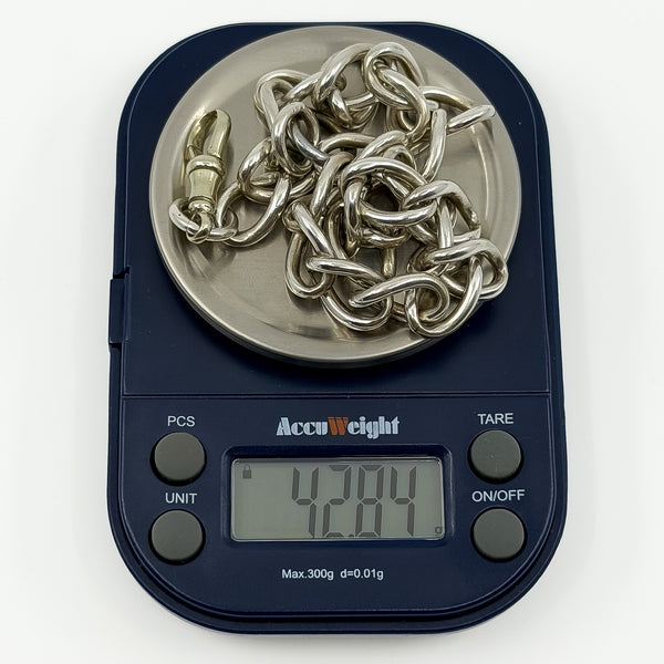Chunky antique sterling silver Albert chain on digital scales weighing approximately 42.8g