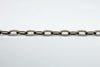 Side view showing the slim open oval link design on a vintage sterling silver bracelet