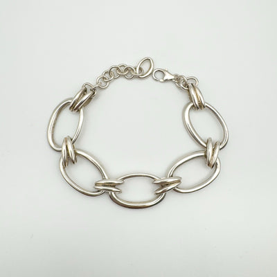 Top view of sterling silver bracelet with large oval and hoop links