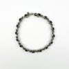 Full view of sterling silver sapphire and diamond tennis bracelet with oval cut sapphires