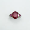 Overhead view highlighting faceted rubies and four accent diamonds