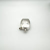 Flat-lay view of engraved sterling silver perfume bottle pendant with screw top