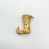 Top-down view of 9ct gold boot pendant with decorative pattern
