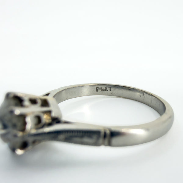 Close up of PLAT stamp inside antique platinum old-cut diamond solitaire ring