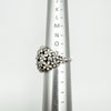 Pandora CZ Darling Daisy Bouquet ring shown on ring sizer at size P–Q
