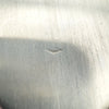  Close-up of worn triangular maker's mark on back of silver locket