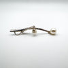 Side view of pendant showing chain bail and two hanging pearls