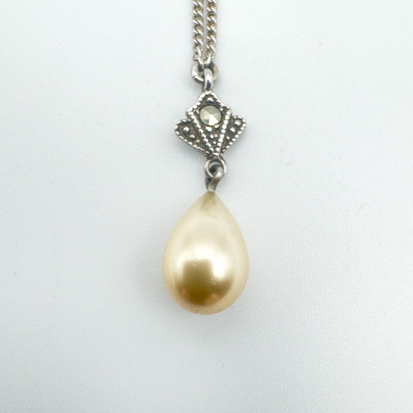 Close-up of vintage pearl drop pendant with marcasite in sterling silver