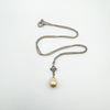Full view of vintage sterling silver necklace with fixed pearl drop pendant